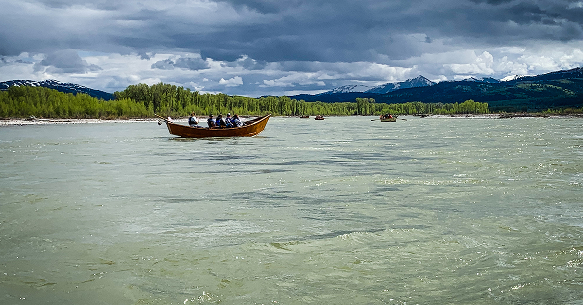 A Wooden Boat Travels Down the Snake River To Tipi Camp, Located In Jackson Hole